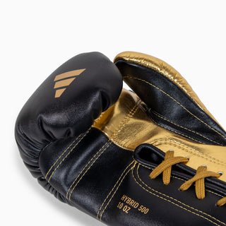Rękawice bokserskie Adidas Hybrid 500 Plusy kontra Sznurówki Czarny-złoty 